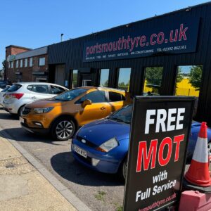 Local tyre shop with customers cars in front