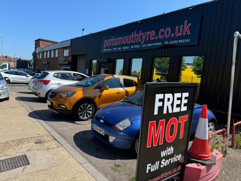 Local tyre shop with customers cars in front